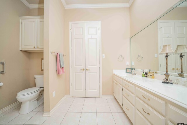 2215 Homestead Ln, Tyler, TX 75701 - bathroom with toilet, tile patterned floors, crown molding, baseboards, and vanity