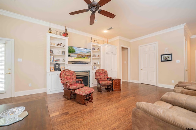2215 Homestead Ln, Tyler, TX 75701 - living area with ceiling fan, crown molding, a fireplace, and visible vents