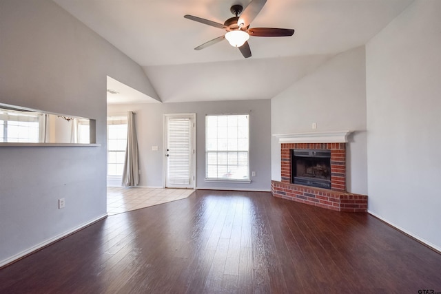 unfurnished living room featuring ceiling fan, lofted ceiling, hardwood / wood-style floors, and a fireplace