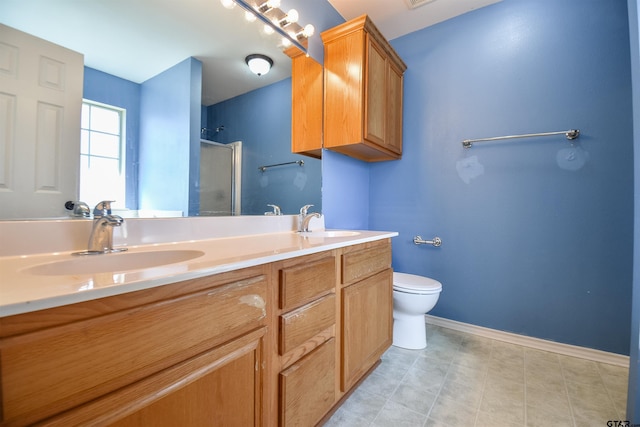 bathroom with vanity, toilet, and an enclosed shower