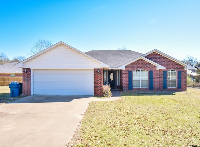 ranch-style home featuring a garage and a front yard