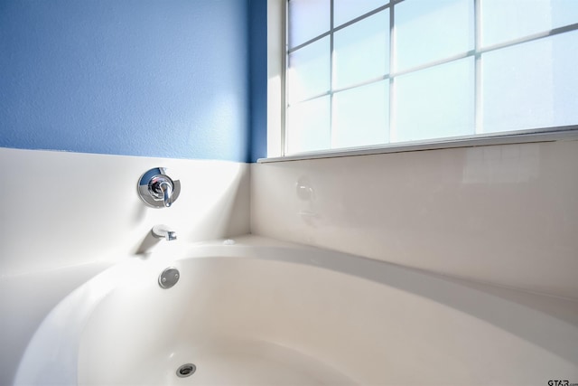 bathroom with a tub