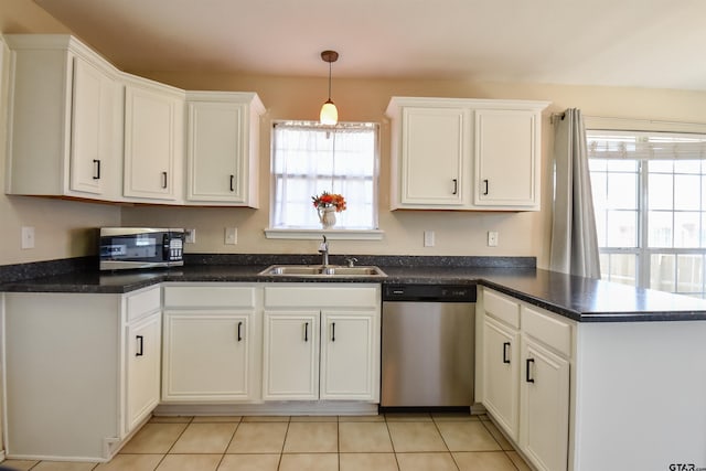 kitchen with sink, stainless steel appliances, and white cabinets