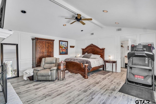 bedroom with lofted ceiling with beams, ceiling fan, and light hardwood / wood-style floors