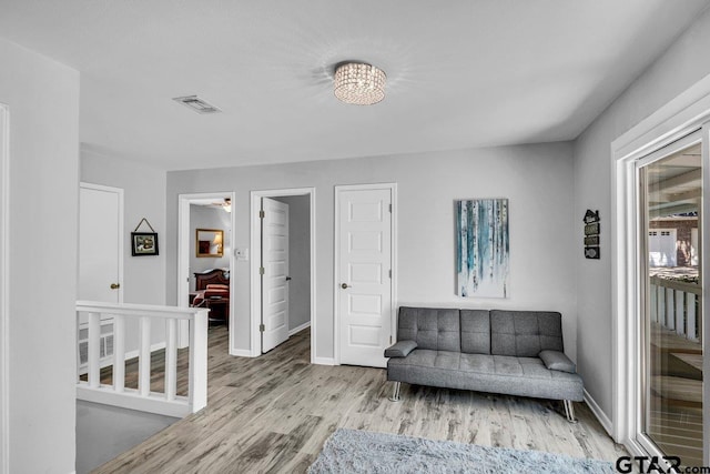 living area with light hardwood / wood-style floors