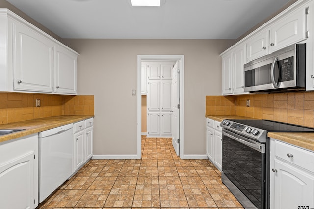 kitchen with white cabinetry and appliances with stainless steel finishes