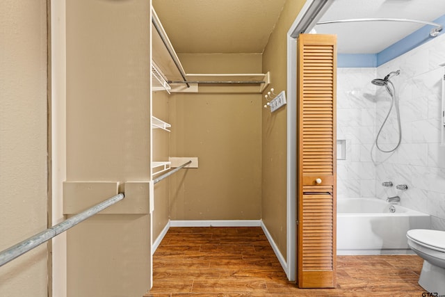 spacious closet featuring hardwood / wood-style flooring