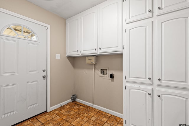 clothes washing area featuring cabinets and hookup for a washing machine