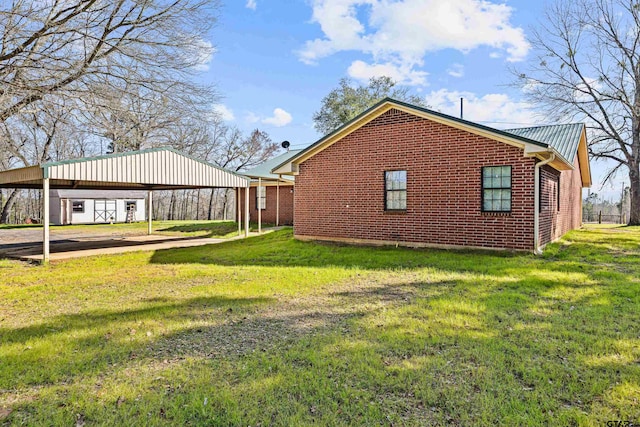 view of property exterior featuring a lawn and a carport