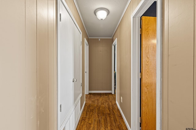 hall with dark hardwood / wood-style flooring and a textured ceiling