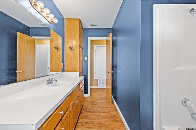 bathroom featuring vanity and wood-type flooring