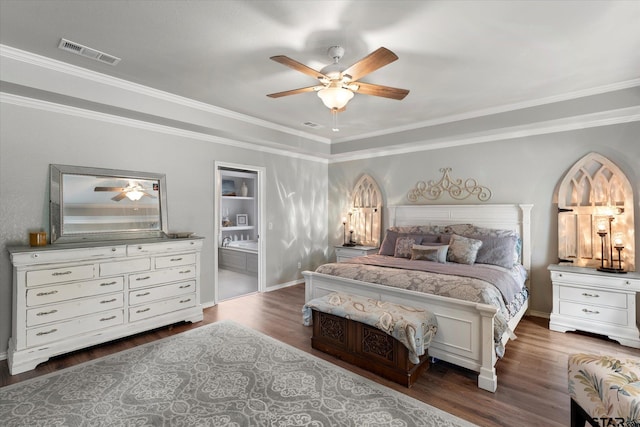 bedroom featuring ceiling fan, ensuite bath, dark hardwood / wood-style flooring, and ornamental molding