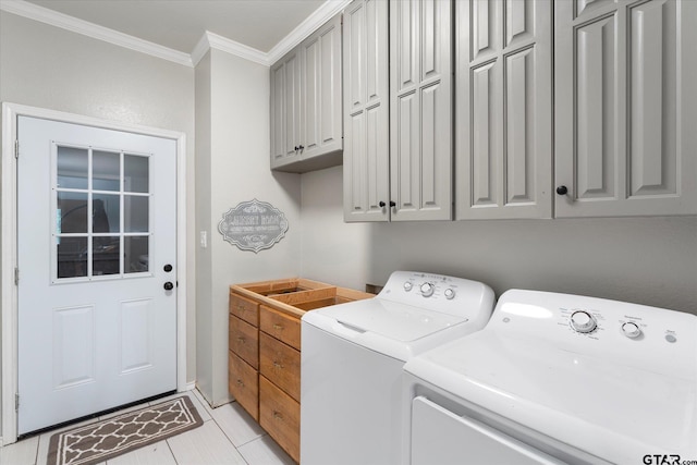 laundry area with washer and dryer, cabinets, light tile patterned floors, and crown molding