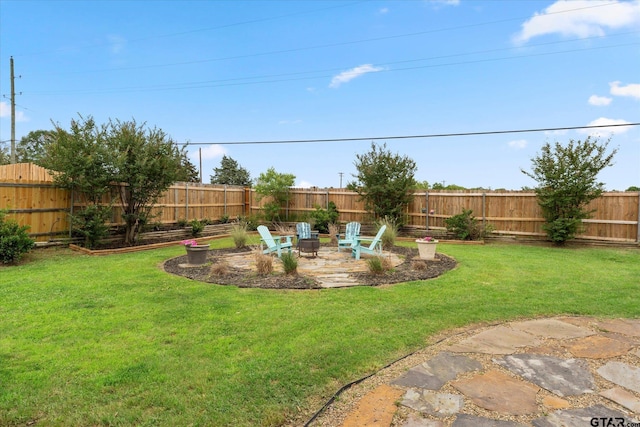 view of yard with an outdoor fire pit and a patio