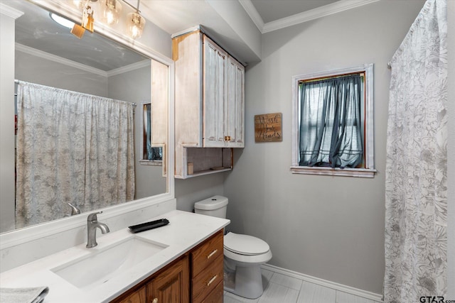 bathroom with toilet, vanity, and ornamental molding