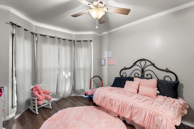 bedroom with dark wood-type flooring, ceiling fan, and crown molding