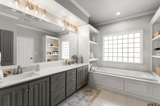 bathroom with vanity, tile patterned flooring, a washtub, and ornamental molding