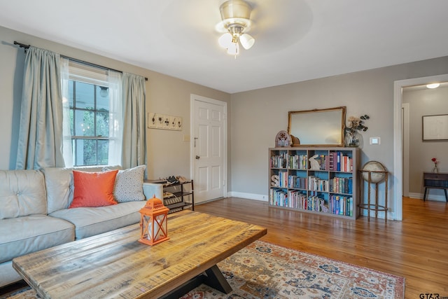 living room with ceiling fan and hardwood / wood-style floors