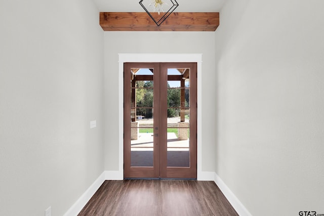 entryway featuring beamed ceiling, dark hardwood / wood-style flooring, and french doors