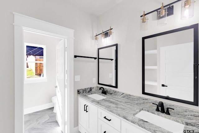 bathroom with vanity and toilet