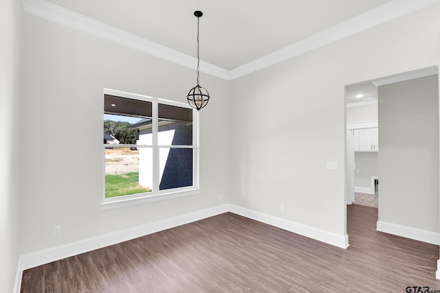 unfurnished dining area featuring ornamental molding, a chandelier, and dark hardwood / wood-style flooring