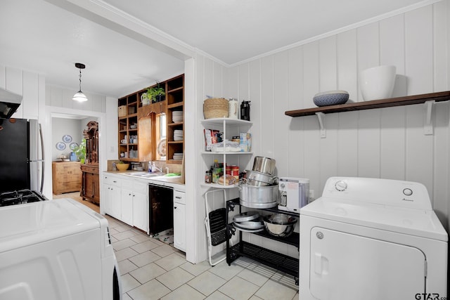 kitchen featuring washer and clothes dryer, hanging light fixtures, crown molding, white cabinets, and stainless steel fridge