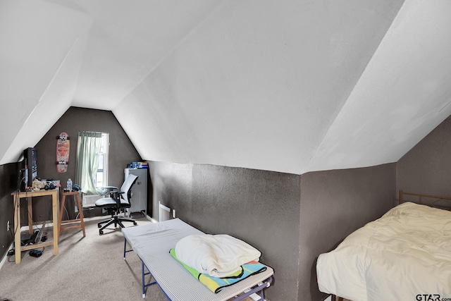 carpeted bedroom with vaulted ceiling