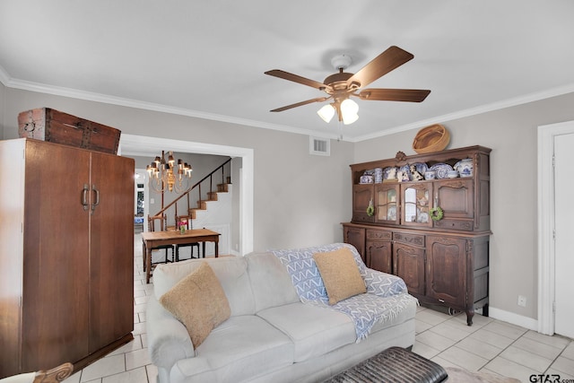 tiled living room with ceiling fan with notable chandelier and crown molding