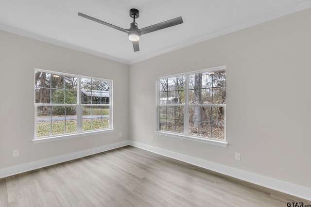 spare room featuring ceiling fan, crown molding, and hardwood / wood-style floors