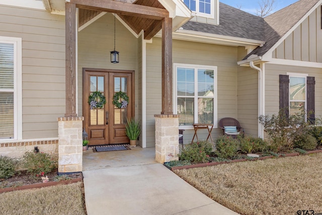 doorway to property with covered porch and french doors