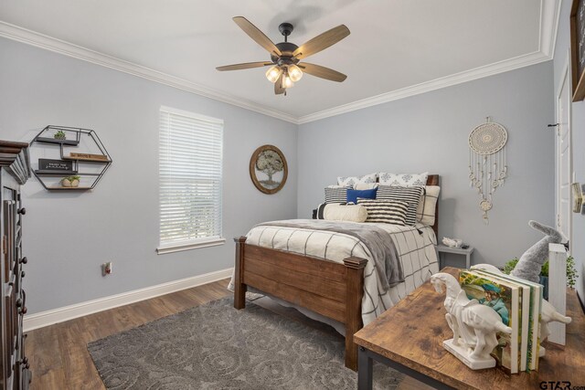 bedroom with dark wood-type flooring, ceiling fan, and crown molding