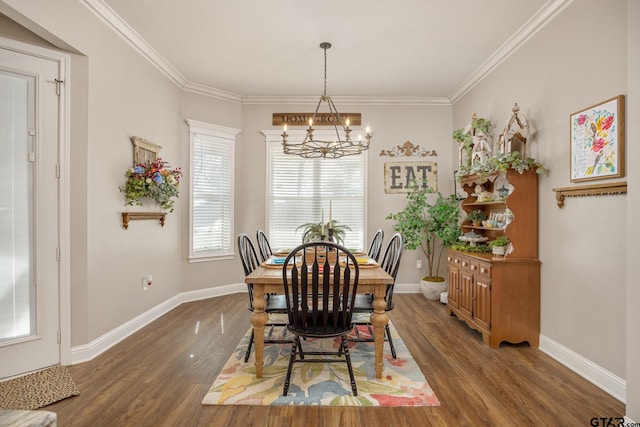 dining space featuring ornamental molding, a notable chandelier, and dark hardwood / wood-style floors