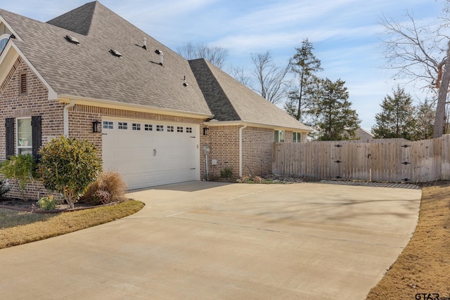 view of side of home featuring a garage