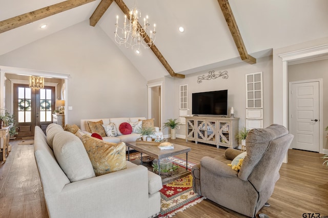 living room with beamed ceiling, french doors, wood-type flooring, high vaulted ceiling, and a notable chandelier