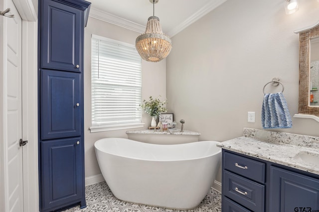 bathroom with a bathing tub, ornamental molding, tile patterned floors, and vanity