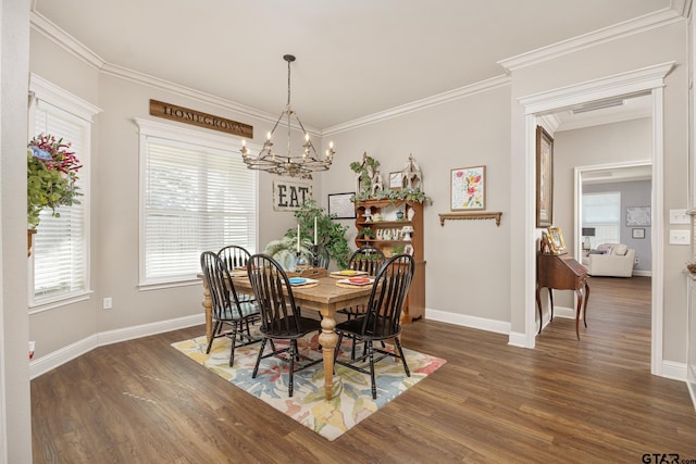 dining space with ornamental molding, a notable chandelier, and dark hardwood / wood-style floors