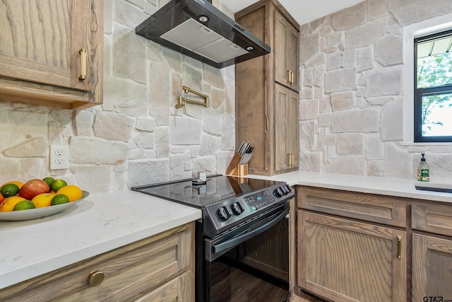 kitchen featuring decorative backsplash, hardwood / wood-style floors, electric range, and wall chimney exhaust hood