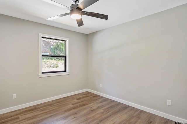 spare room with ceiling fan and hardwood / wood-style floors