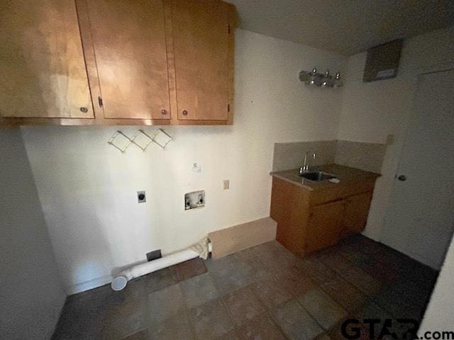 washroom with cabinets, hookup for a washing machine, electric dryer hookup, and sink