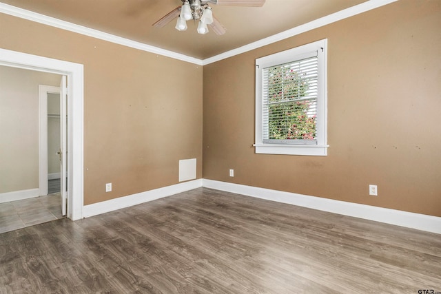 spare room with hardwood / wood-style floors, ceiling fan, and crown molding