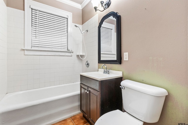 full bathroom featuring tile patterned flooring, vanity, crown molding, toilet, and tiled shower / bath combo