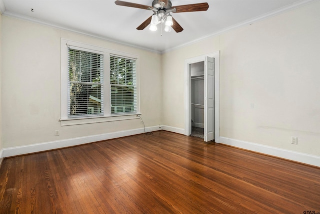 unfurnished bedroom with ceiling fan, a closet, dark hardwood / wood-style flooring, and ornamental molding