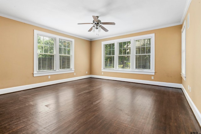 unfurnished room featuring ornamental molding, dark wood-type flooring, a healthy amount of sunlight, and ceiling fan