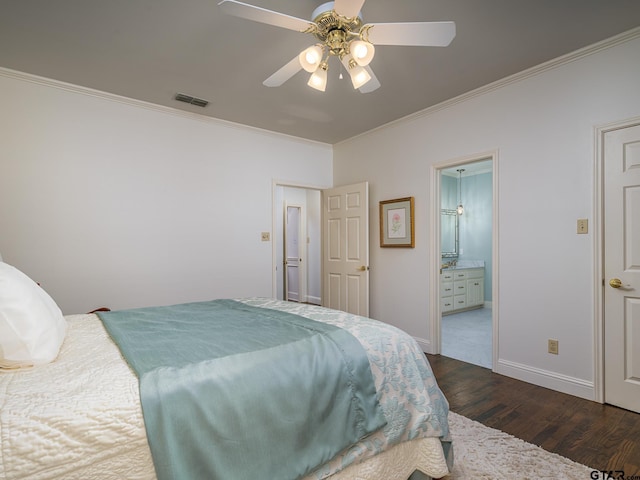 bedroom with ceiling fan, dark wood-type flooring, ornamental molding, and ensuite bath