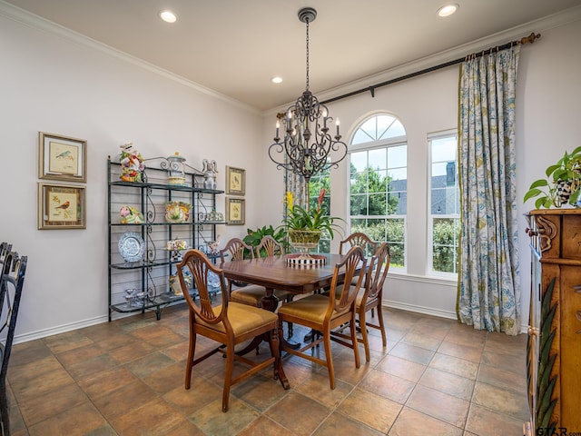 dining room featuring crown molding and a notable chandelier