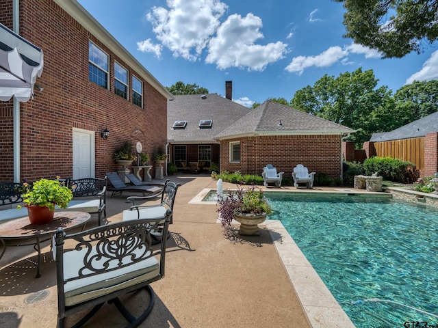 view of pool featuring a patio