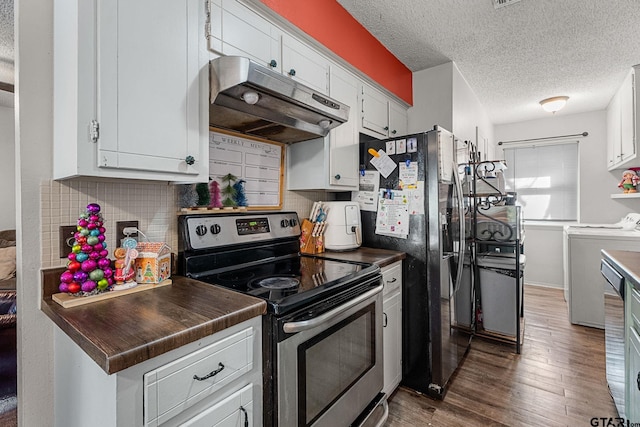 kitchen with appliances with stainless steel finishes, dark hardwood / wood-style flooring, backsplash, washer and clothes dryer, and white cabinetry