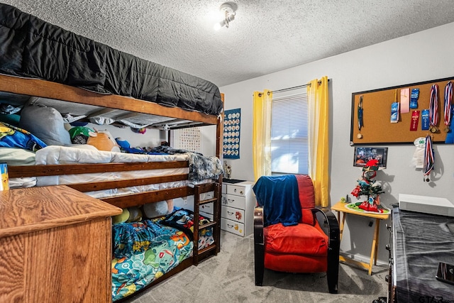 bedroom with light colored carpet and a textured ceiling