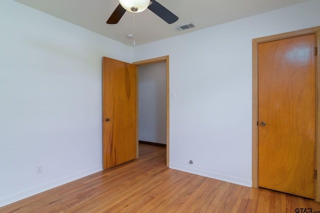 unfurnished bedroom featuring ceiling fan and light hardwood / wood-style flooring