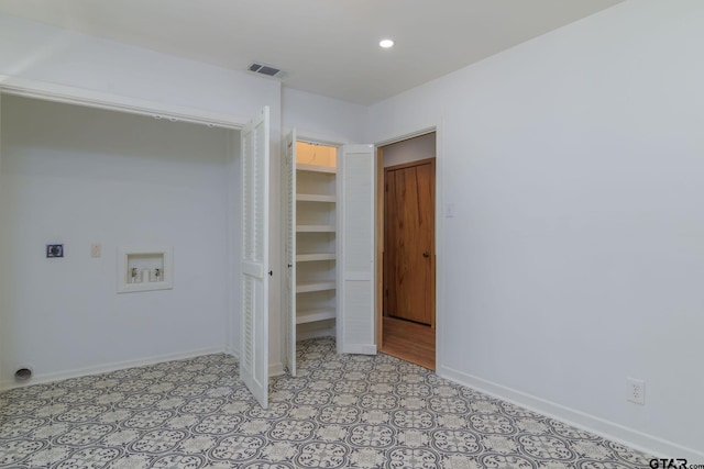 washroom with hookup for an electric dryer and hookup for a washing machine